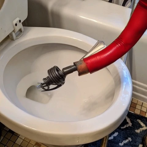 Unclogging a fork that was stuck in a main drain